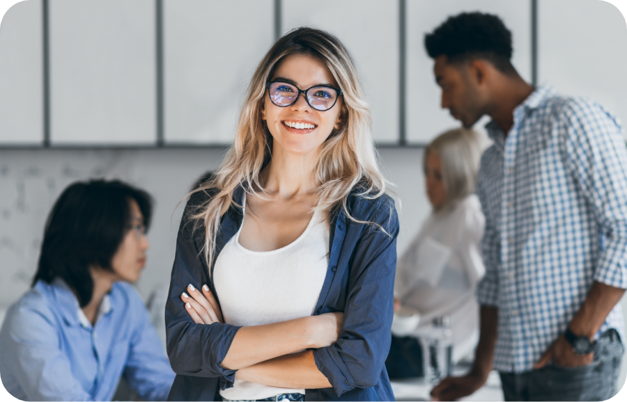 confident-blonde-female-manager-posing-with-smile-after-conference-with-other-employees-asian-programmer-talking-with-african-freelancer-while-fair-ha