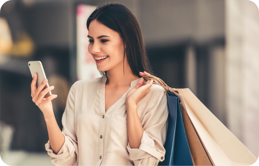 hermosa-chica-sosteniendo-bolsas-compra